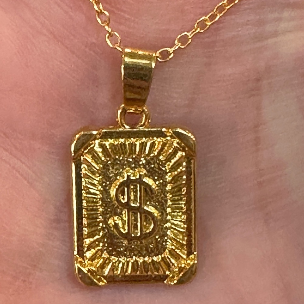 Goldtone Dollar Sign Pendant Necklace. Gold over 925 chain. Bright & polished.